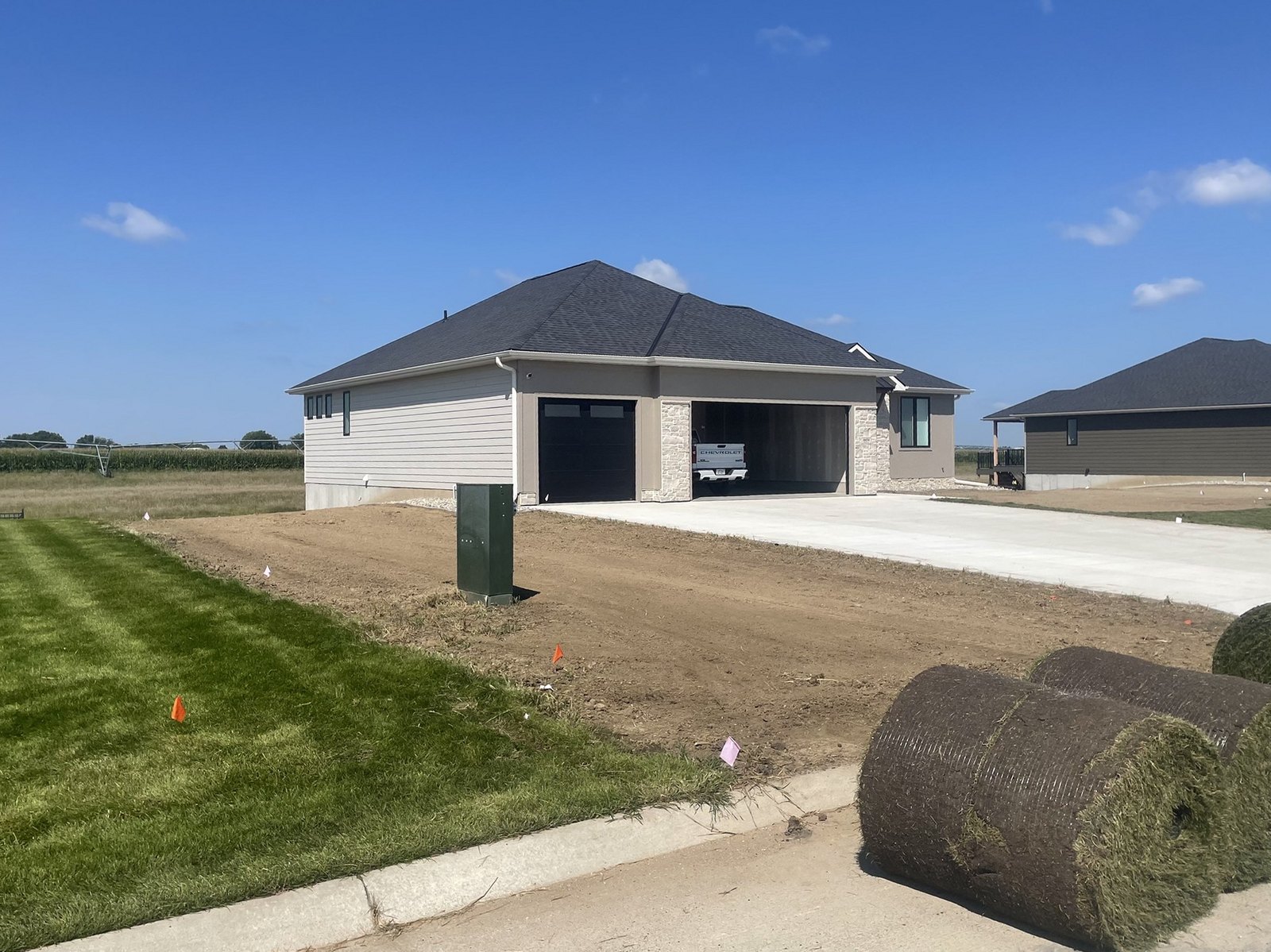 Schuetze Sod crew installing sod on a new residential lot