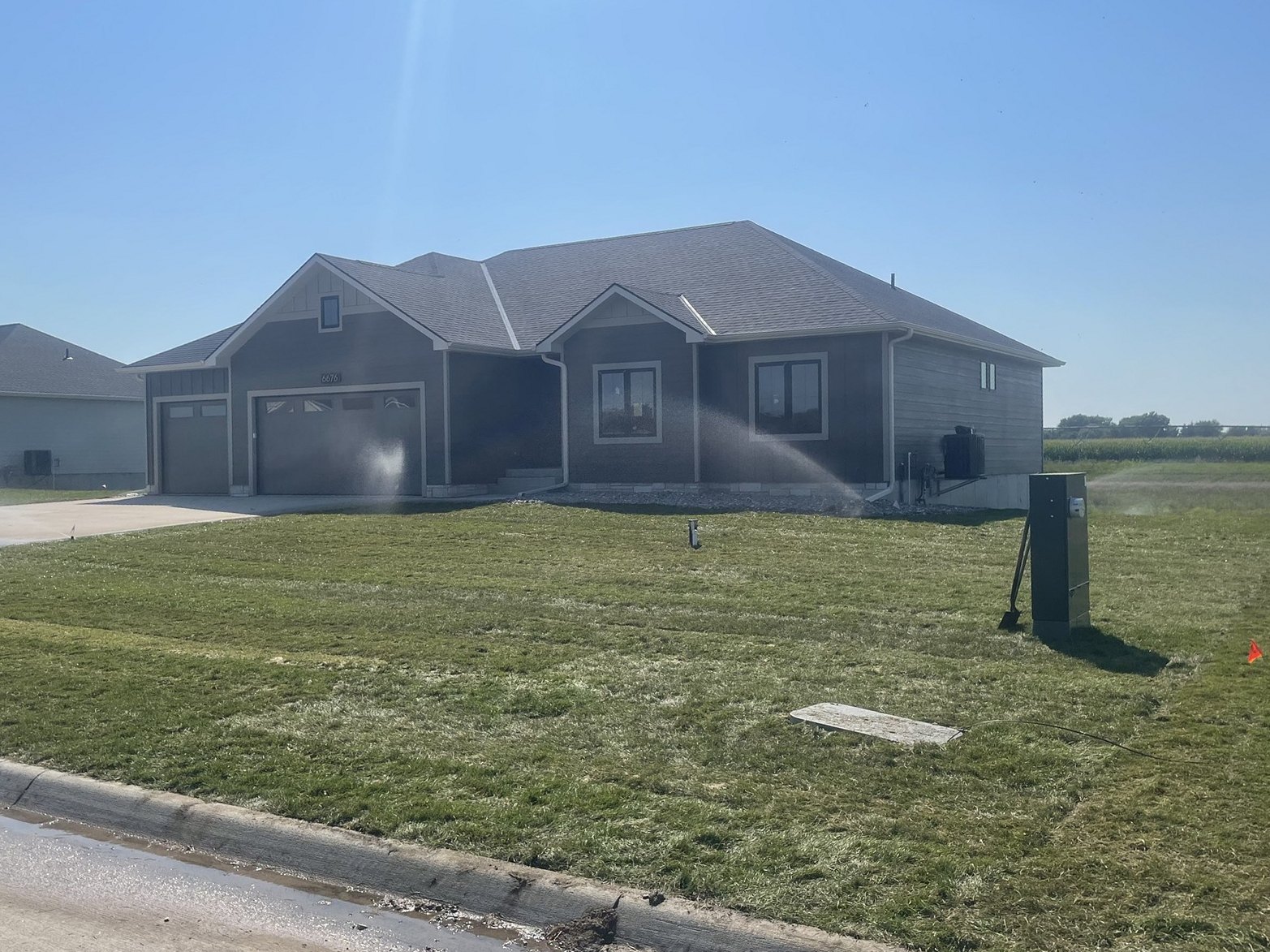 Sprinkler zones running on a freshly sodded lawn